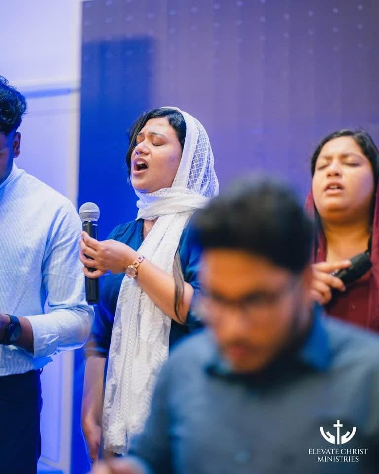 The worship team leading sung worship at Elevate Christ Ministries